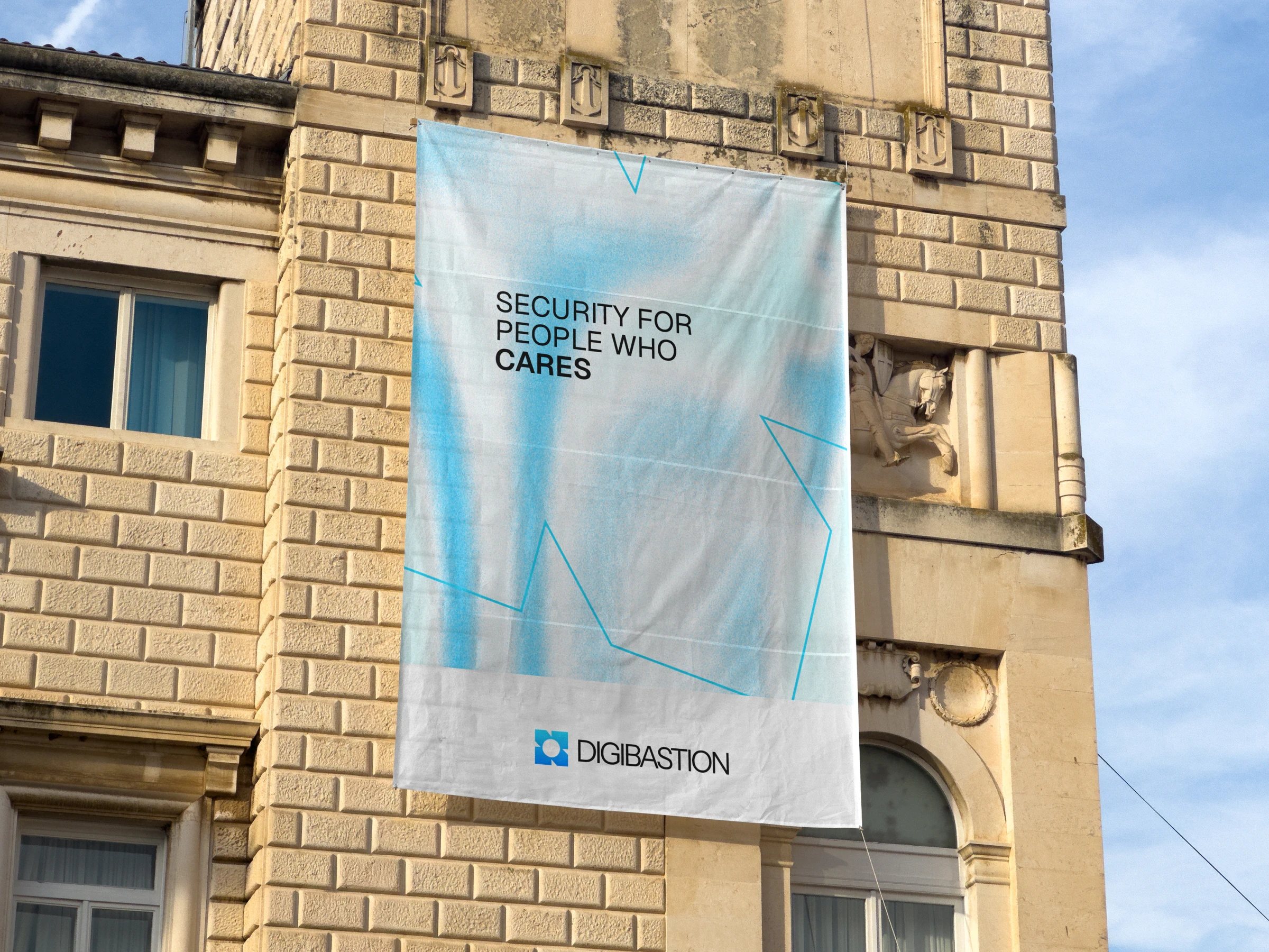 A Digibastion banner hanging on a stone building facade