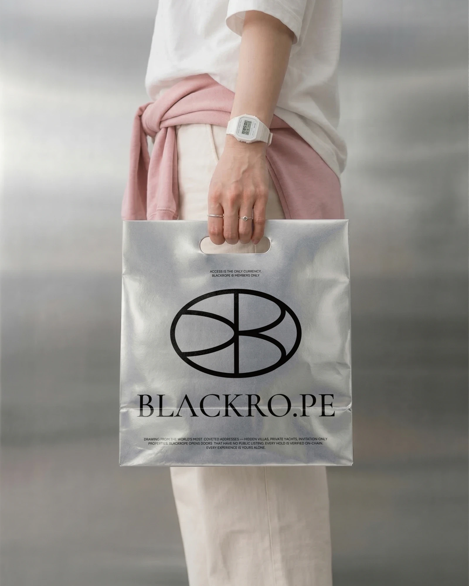 A clear Blackrope shopping bag with the seal, carried by a woman in white