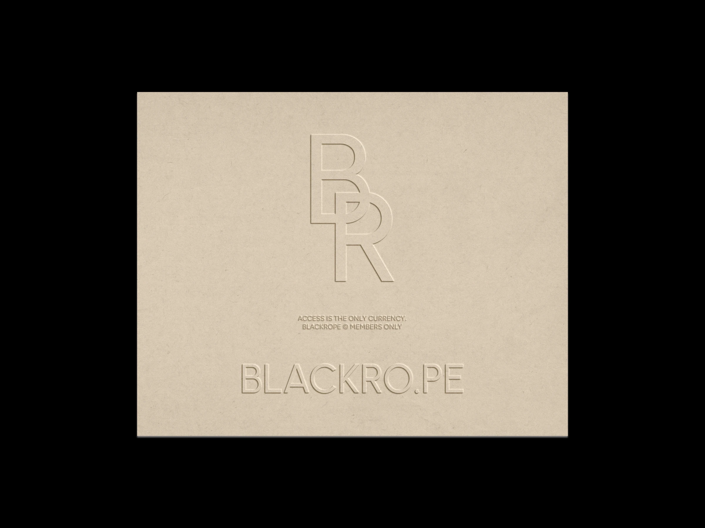 The geometric monogram and wordmark blind-embossed on cream card