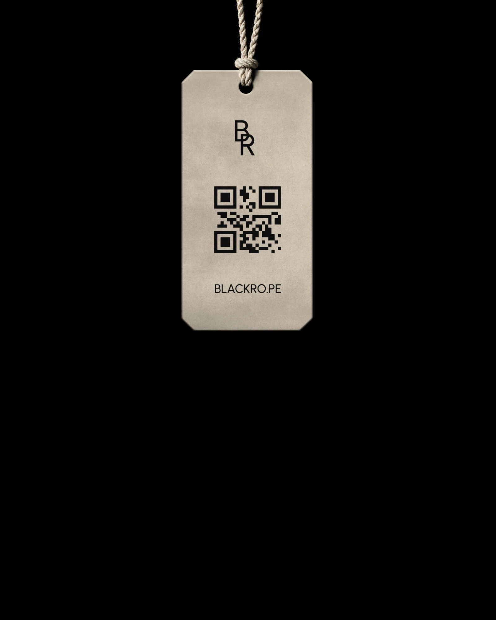 A hang tag with the monogram and a QR code on a string