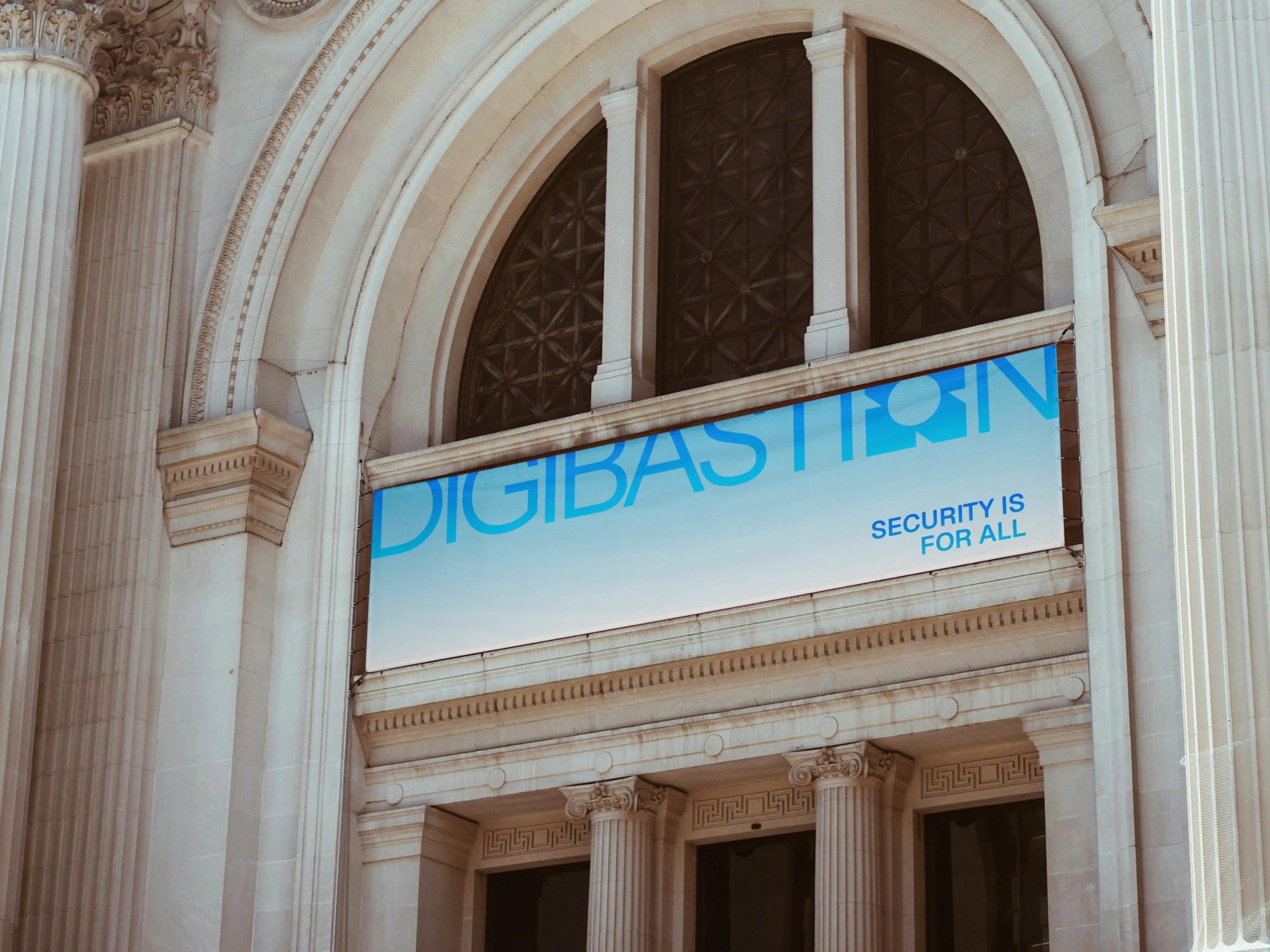 A Digibastion banner reading Security is for all across the arched facade of a classical building