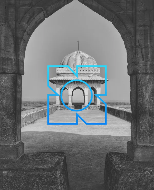 A domed pavilion seen through a pointed arch, the mark outlined in blue over it